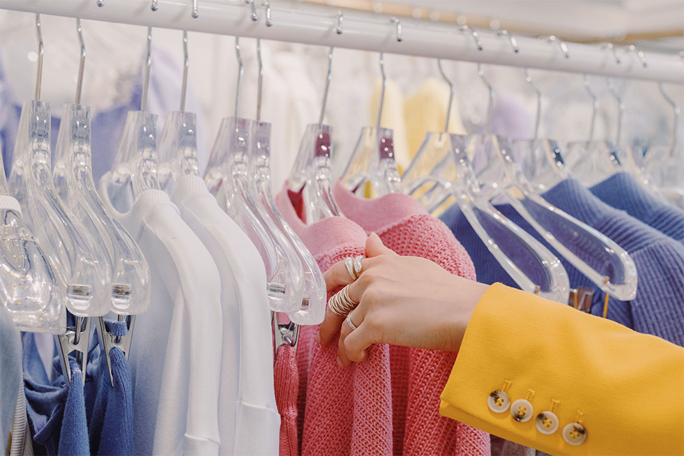 woman checking dry cleaned clothes