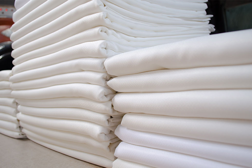 folded white bedsheet